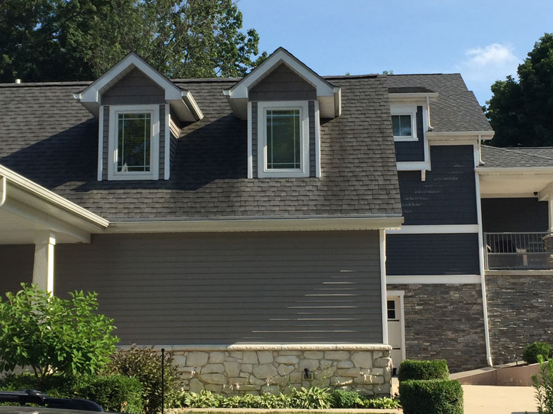 black streaks on roof before roof washing from tree frog softwash in northeast indiana